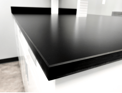 Quick ship black phenolic tables with chemical resistant tops 