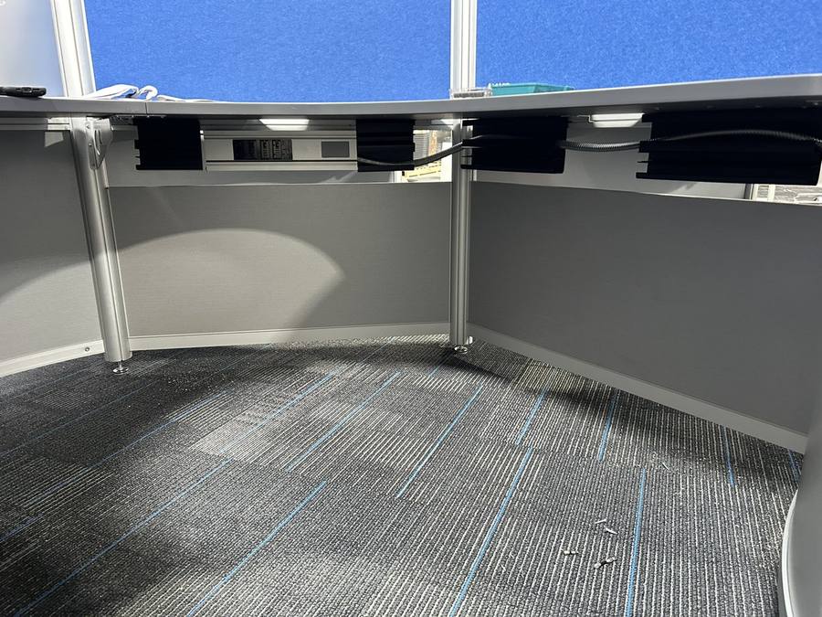 Seamless wire management built into every contemporary curvilinear workstation: integrated cable channels, power modules, and data ports keep 500 modern office cubicles completely clutter-free.