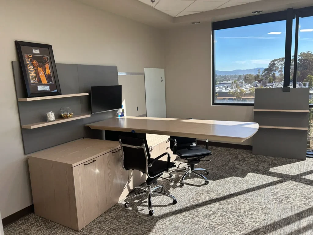 This executive wanted multiple places to have collaborative meetings. This is a height adjustable desk that doubles as a conference. He ended up with two areas for break out collaborative.