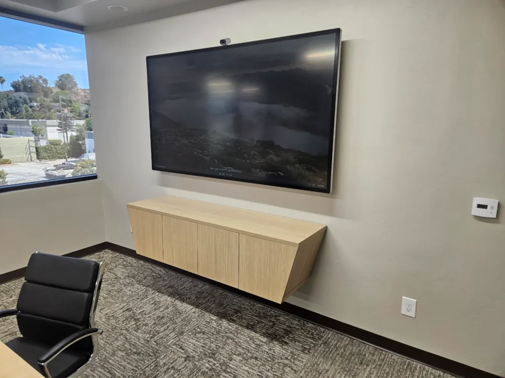 Moved TV to opposite wall to solve specific problems. Attractive modern credena below.