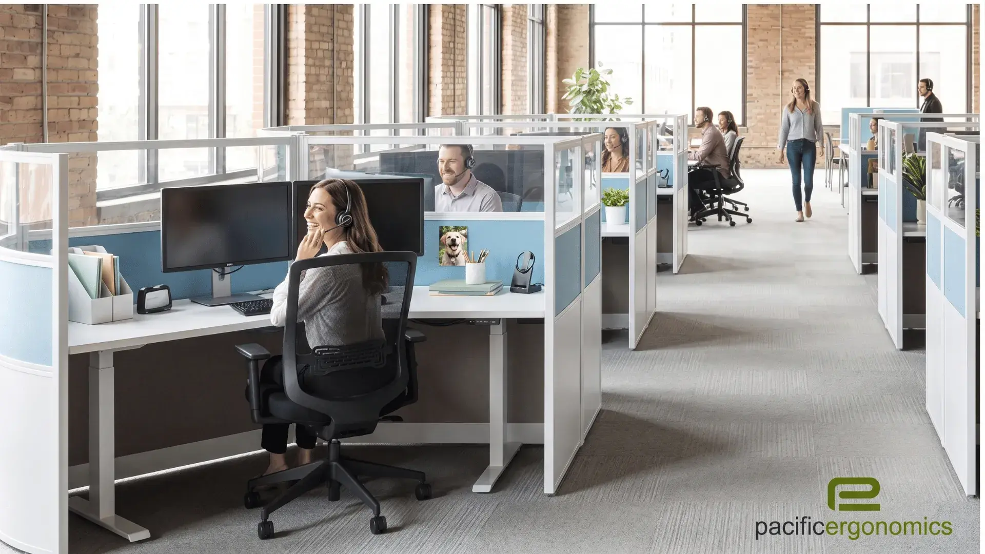 2 person cubicle with light blue fabric panels, white frame and white height-adjustable desks